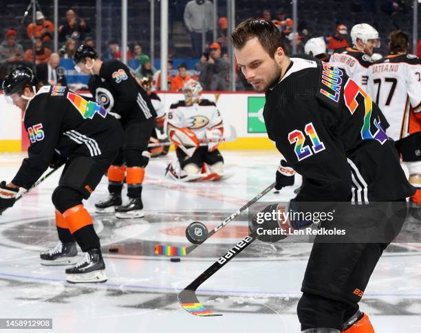 Scott Laughton of the Philadelphia Flyers flips the puck in the air during warm-ups prior to his game against the Anaheim Ducks at the Wells Fargo...