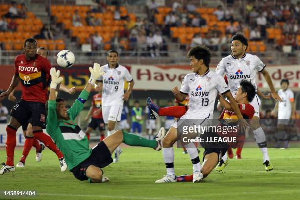 Toshiyuki Takagi of Shimizu S-Pulse scores the team's fourth goal past Seigo Narazaki of Nagoya Grampus during the J.League Yamazaki Nabisco Cup...