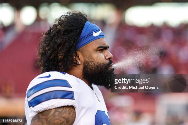 Ezekiel Elliott of the Dallas Cowboys sprays water from his mouth prior to an NFL divisional round playoff football game between the San Francisco...