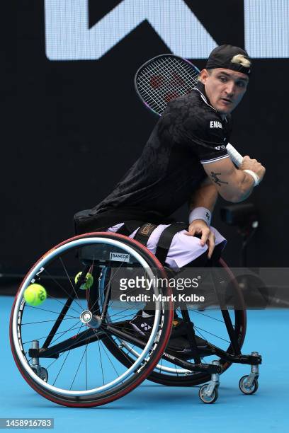 Gustavo Fernandez of Argentina plays a backhand in his Men's Wheelchair Singles match against Ruben Spaargaren of the Netherlands during day nine of...