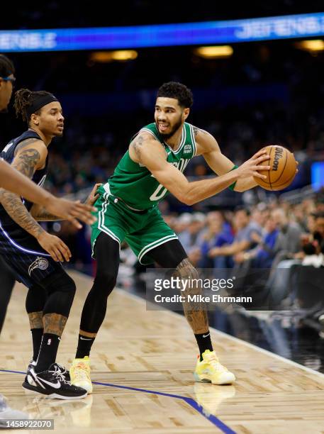 Jayson Tatum of the Boston Celtics looks to pass during a game against the Orlando Magic at Amway Center on January 23, 2023 in Orlando, Florida....