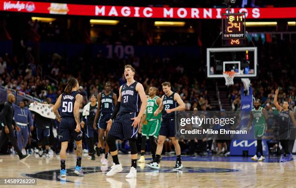 Moritz Wagner and Cole Anthony of the Orlando Magic react to a play during a game against the Boston Celtics at Amway Center on January 23, 2023 in...