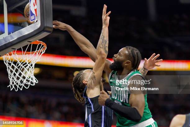 Jaylen Brown of the Boston Celtics dunks over Cole Anthony of the Orlando Magic during a game at Amway Center on January 23, 2023 in Orlando,...
