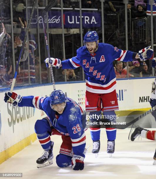 Jimmy Vesey of the New York Rangers celebrates his second period goal against the and is joined by Barclay Goodrow at Madison Square Garden on...