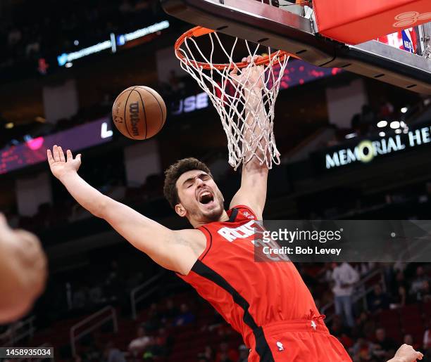 Alperen Sengun of the Houston Rockets is fouled as he drives to the basket during the first quarter against the Minnesota Timberwolves at Toyota...