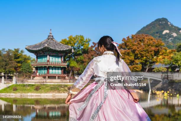 tourist wearing hanbok korea traditional dress travel to gyeongbokgung palace to learn historical and relax in seoul. south korea. - korea landmark stock pictures, royalty-free photos & images