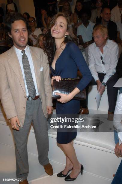 David Lauren and actress Emmy Rossum front row at Ralph Lauren's spring 2005 show in New York.