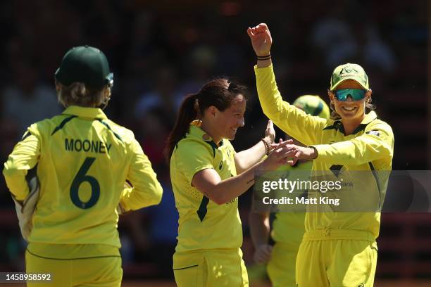 Meg Lanning of Australia celebrates after taking a catch off a Megan Schutt of Australia delivery, to dismiss Fatima Sana of Pakistan, during game...