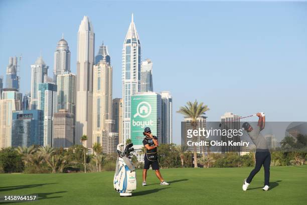 Shubhankar Sharma of India plays their second shot on the 13th hole during the Pro-Am prior to the Hero Dubai Desert Classic at Emirates Golf Club on...