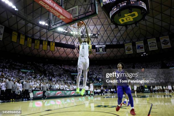 Jalen Bridges of the Baylor Bears dunks the ball against Jalen Wilson of the Kansas Jayhawks in the second half at Ferrell Center on January 23, 2023...