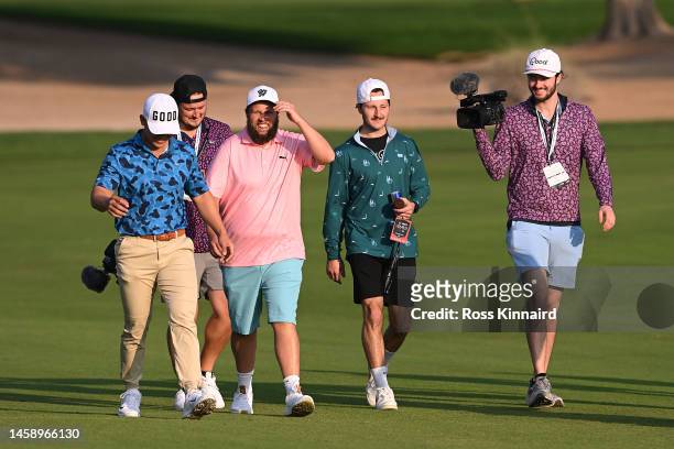 Andrew Johnston of England and playing partners walk on the 10th hole during the Pro-Am prior to the Hero Dubai Desert Classic at Emirates Golf Club...
