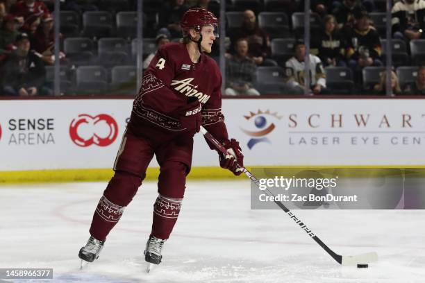 Juuso Valimaki of the Arizona Coyotes skates with the puck against the Vegas Golden Knights in the first period at Mullett Arena on January 22, 2023...