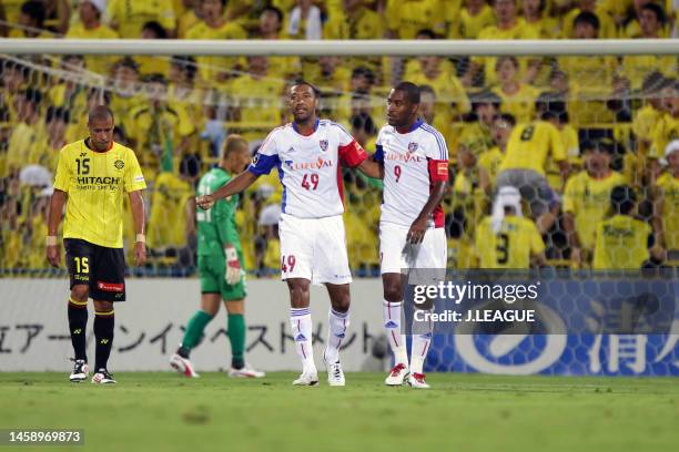 Lucas Severino of FC Tokyo celebrates with teammate Edmilson after scoring the team's first goal during the J.League J1 match between Kashiwa Reysol...