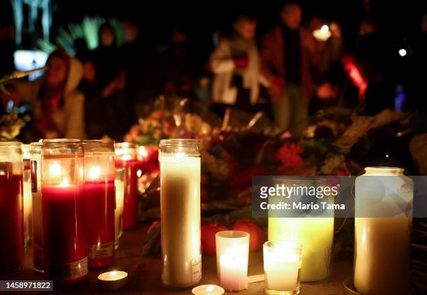 People gather at a candlelight vigil for victims of a deadly mass shooting at a ballroom dance studio on January 23, 2023 in Monterey Park,...