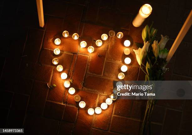 Candles form a heart at a candlelight vigil for victims of a deadly mass shooting at a ballroom dance studio on January 23, 2023 in Monterey Park,...