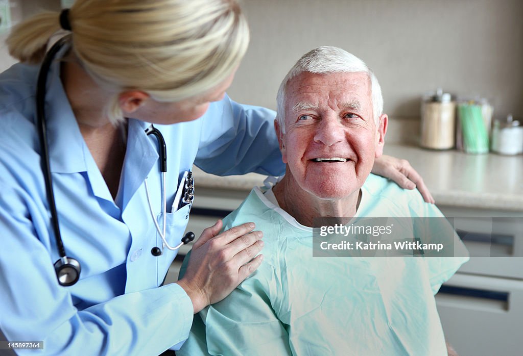 Doctor comforts patient.
