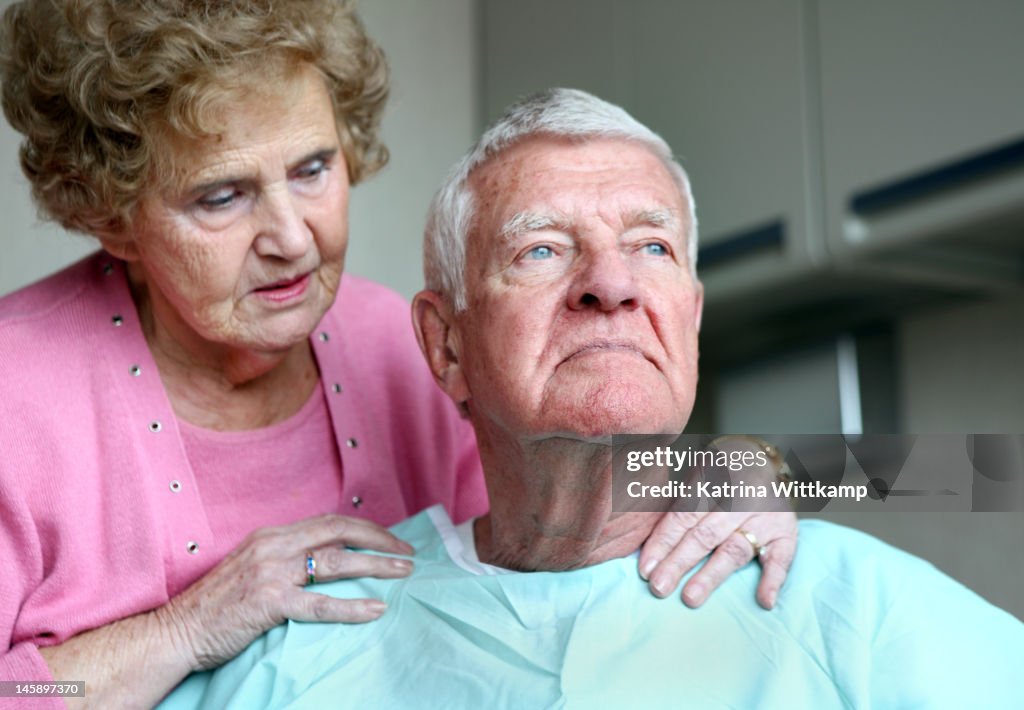 Wife comforts her husband.