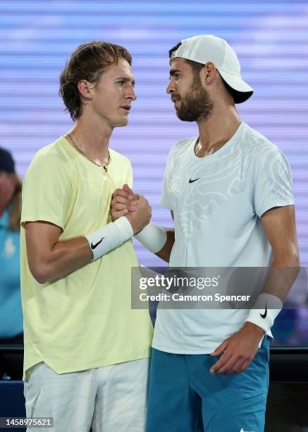 Karen Khachanov of Russia and Sebastian Korda of the United States embrace at the net after the quarterfinal singles match during day nine of the...