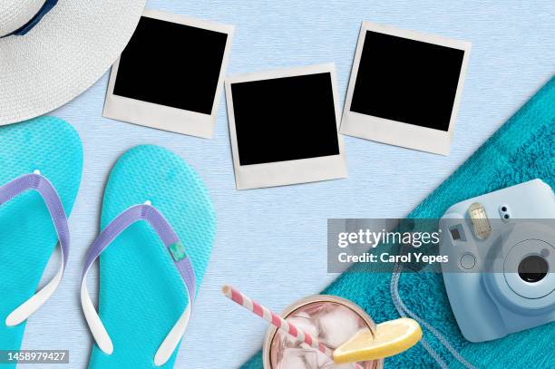 stack of blank instant print transfer with instant camera in sand beach.summer memories - photograph mockup stock pictures, royalty-free photos & images