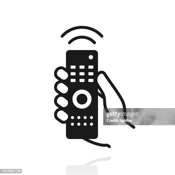 hand with remote control. icon with reflection on white background - holding remote control stock illustrations