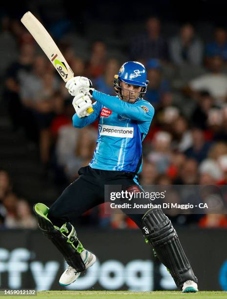 Alex Carey of the Strikers bats during the Men's Big Bash League match between the Melbourne Renegades and the Adelaide Strikers at Marvel Stadium,...