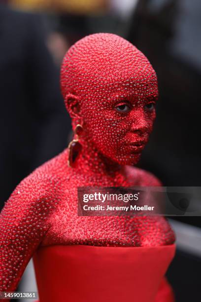 Doja Cat is seen wearing a full red glittery Look ,long dress and earrings outside Schiaparelli show, during the Paris Fashion Week - Haute Couture...