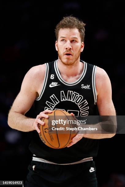 Jakob Poeltl of the San Antonio Spurs looks on during the fourth quarter against the Portland Trail Blazers at Moda Center on January 23, 2023 in...