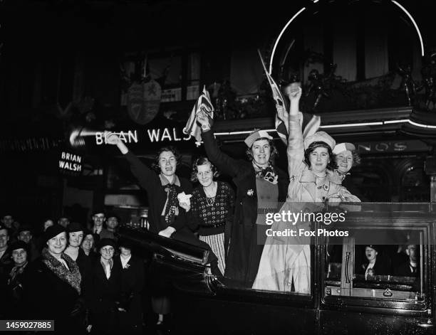 Female revellers celebrating the coronation of George VI and Queen Elizabeth, in London, England, 12th May 1937. The celebrations followed the...