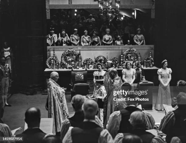 British clergyman Cosmo Gordon Lang , Archbishop of Canterbury, conducts the coronation of Queen Elizabeth, Queen consort during the coronation...