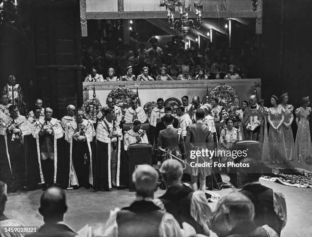 George VI and Queen Elizabeth during their coronation ceremony, conducted by British clergyman Cosmo Gordon Lang , Archbishop of Canterbury, held at...