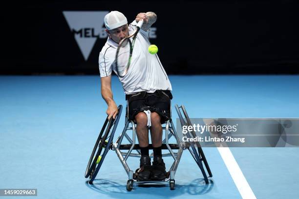 Andy Lapthorne of Great Britain plays a backhand in the Quad Wheelchair Singles quarterfinals match against David Wagner of the United States during...