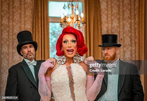 a beautiful elegant 1920s style redhead drag queen with chaperones - lgbt history stock pictures, royalty-free photos & images