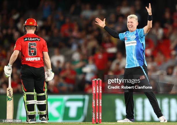 Peter Siddle of the Strikers takes the wicket of Sam Harper of the Renegades during the Men's Big Bash League match between the Melbourne Renegades...