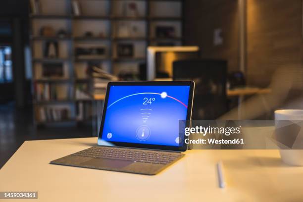 tablet pc with temperature control dashboard on screen - office thermostat stock pictures, royalty-free photos & images