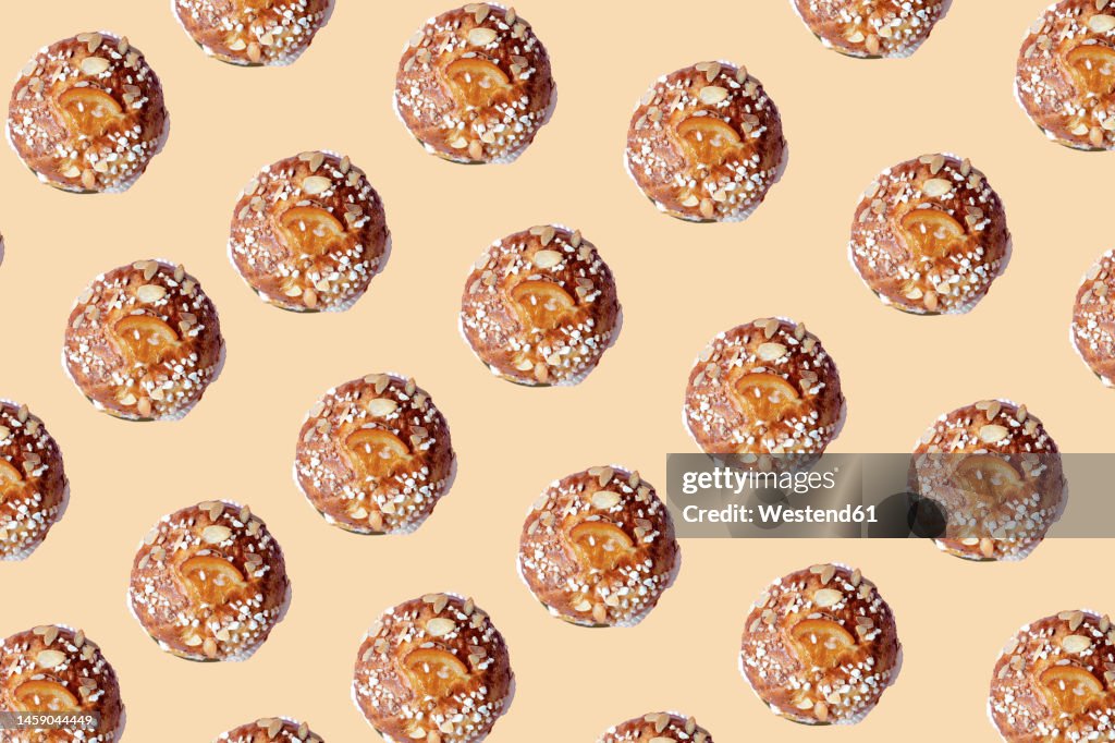 Little king cake pattern over beige background