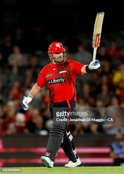 Aaron Finch celebrates after scoring his half century during the Men's Big Bash League match between the Melbourne Renegades and the Adelaide...
