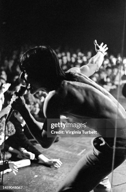 Iggy Pop performing and interacting with fans live onstage at Manchester Apollo, 7th February 1980,