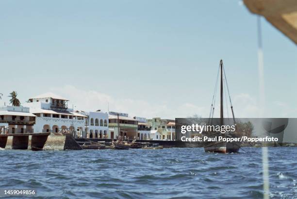 Boats moored at a quayside in the town of Lamu on the Indian Ocean coast of Kenya in July 1971. The town is on Lamu Island just off the coast of the...