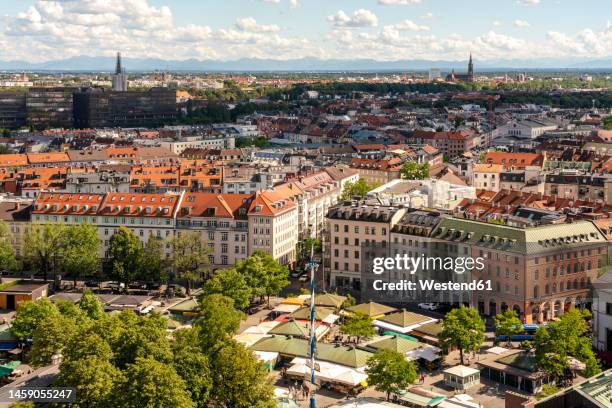 germany, munich,victuals market with apartment buildings in background - viktualienmarkt stock pictures, royalty-free photos & images
