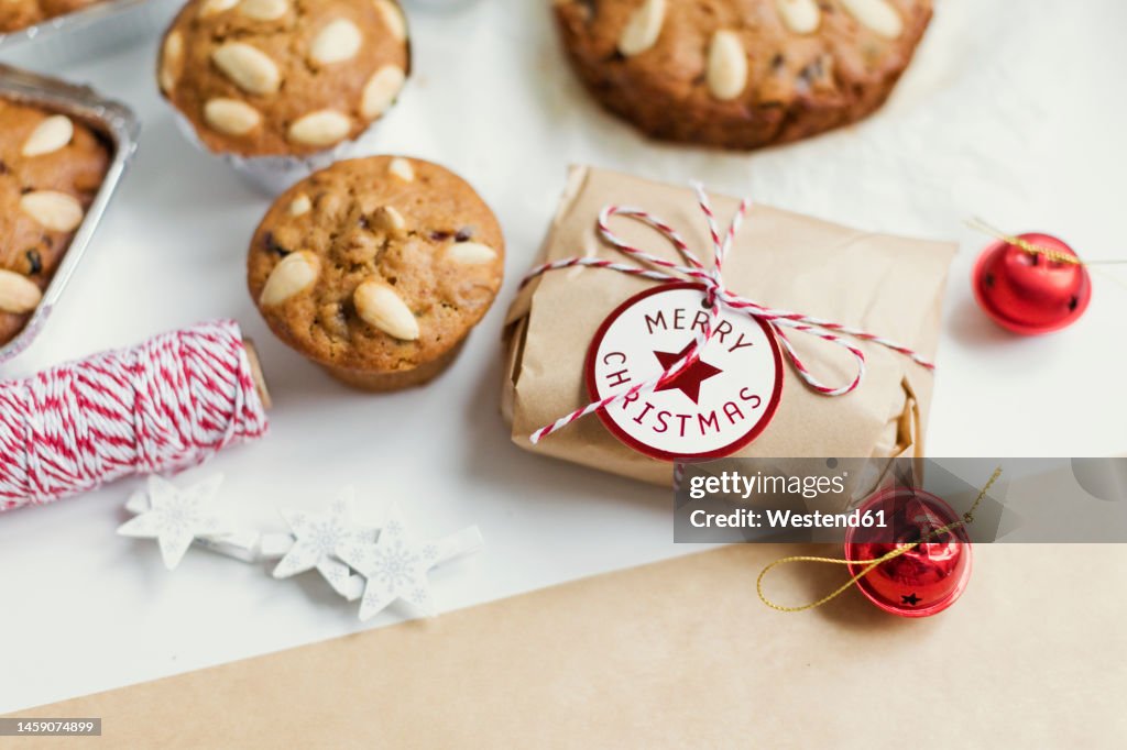 Traditional Dundee cakes and wrapped Christmas present