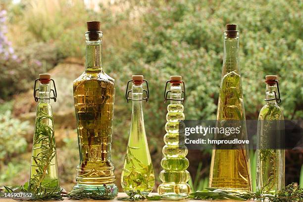 herb oils and vinegars - tarragon oil stock pictures, royalty-free photos & images