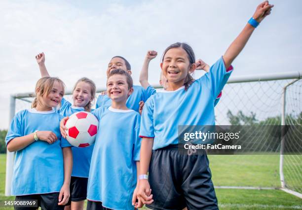 three cheers! - family football team stock pictures, royalty-free photos & images