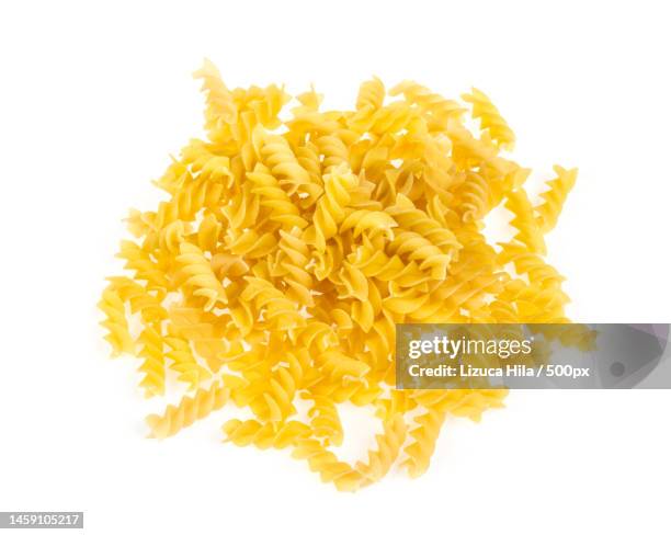 a portion of rotini corkscrew pasta isolated on white,romania - carbohydrate food type stock pictures, royalty-free photos & images