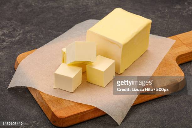 high angle view of cheese on table,romania - バター ストックフォトと画像