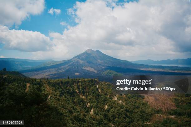 scenic view of landscape against sky,kintamani,indonesia - kintamani stock pictures, royalty-free photos & images