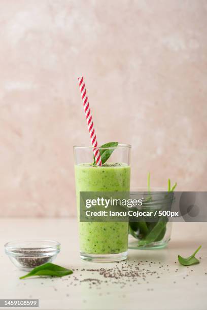 vegetarian green smoothie avocado,spinach leaves and chia seeds healthy concept selective focu,romania - avocado smoothie stock pictures, royalty-free photos & images