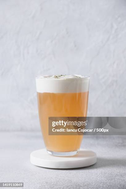 cheese tea with layer of creamy foam asian trendy beverage thai milk tea,romania - wheat beer stock pictures, royalty-free photos & images