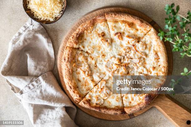 homemade pizza with chicken and cheese on white sauce,light concrete background,romania - pastetengericht stock-fotos und bilder