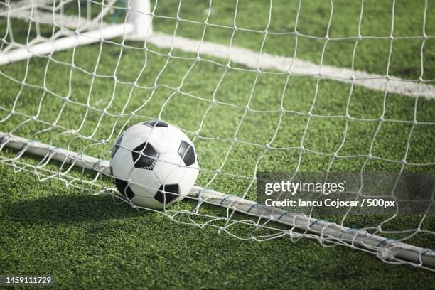 close-up of soccer ball on field,romania - tor konstruktion stock-fotos und bilder