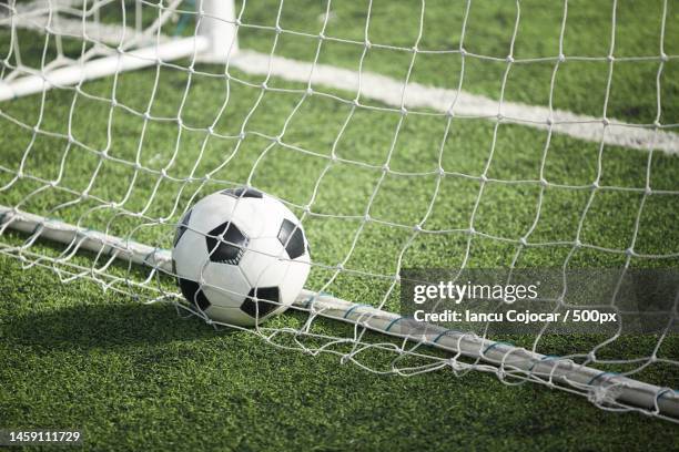 close-up of soccer ball on field,romania - scoring a goal ストックフォトと画像